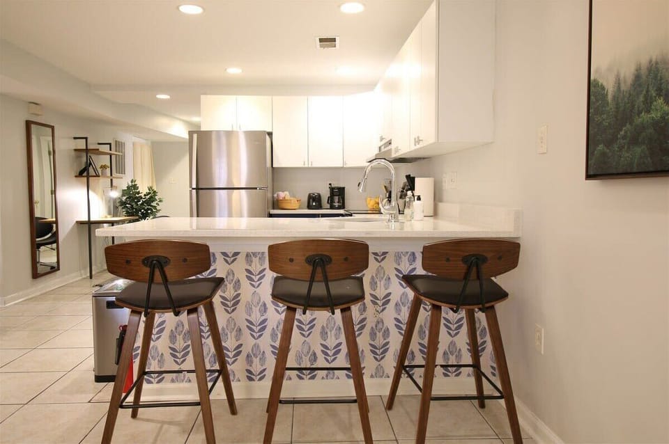 Kitchen island bar area is ideal for grabbing some grub before heading out and exploring