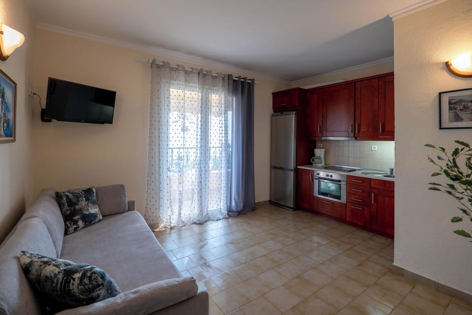 Apartment, 1 Bedroom, Smoking, Balcony | Living room | TV
