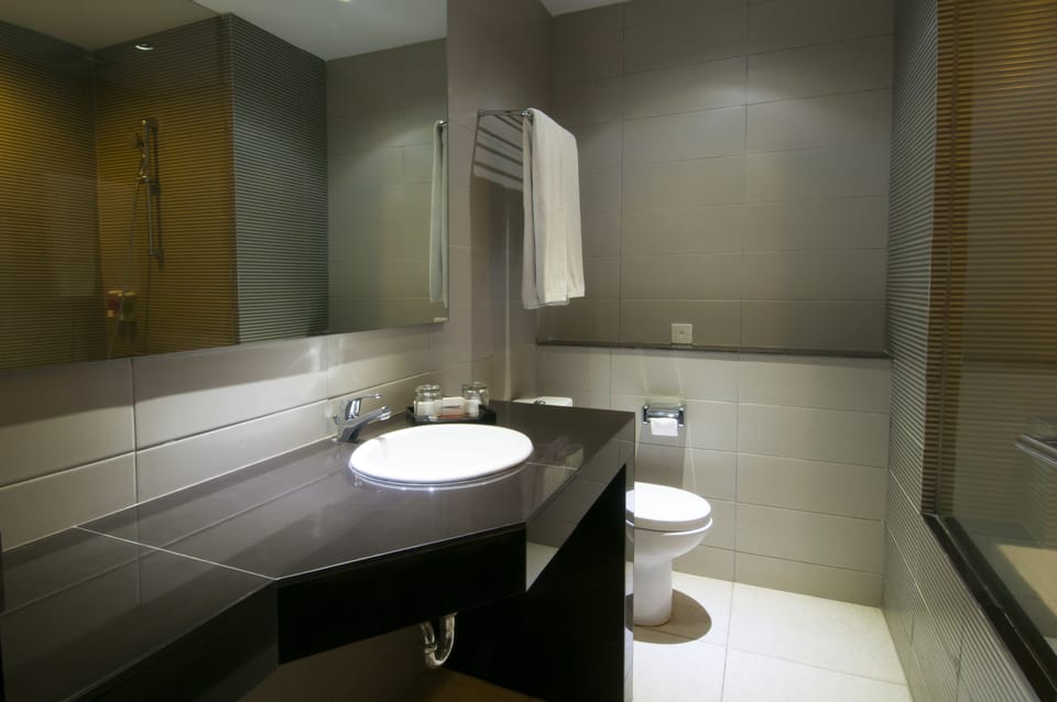 Premier Room | Bathroom | Hair dryer, slippers, bidet, towels