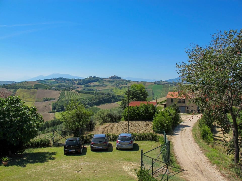 Sky, Plant, Car, Ecoregion, Vehicle, Natural Environment, Natural Landscape, Tree, Motor Vehicle, Land Lot