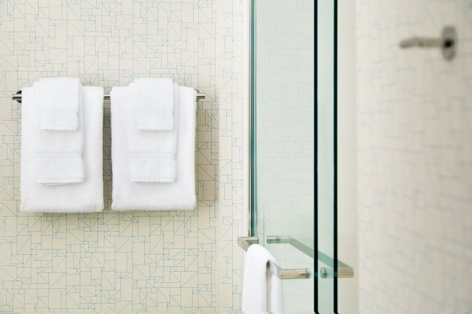 Rainfall showerhead, eco-friendly toiletries, hair dryer, towels