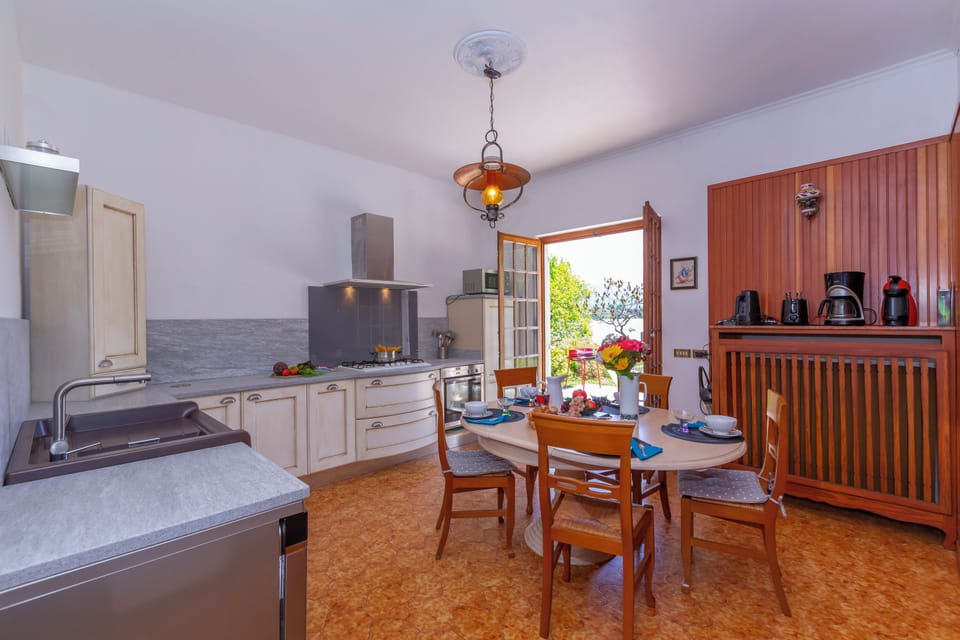 Family Villa, 3 Bedrooms, 2 Bathrooms, Lakeside (Villa Martine Au Bord Du Lac with) | Private kitchen | Coffee/tea maker, full-size fridge, microwave, oven