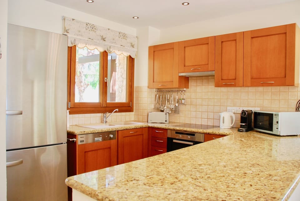 Villa | Private kitchen | Coffee/tea maker, full-size fridge, microwave, oven