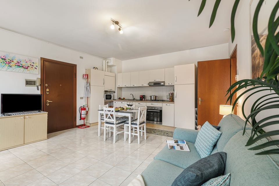 Family Apartment, Multiple Bedrooms (Petalo Bianco 100m from lake) | Living area | 22-inch flat-screen TV with digital channels, TV, video-game console