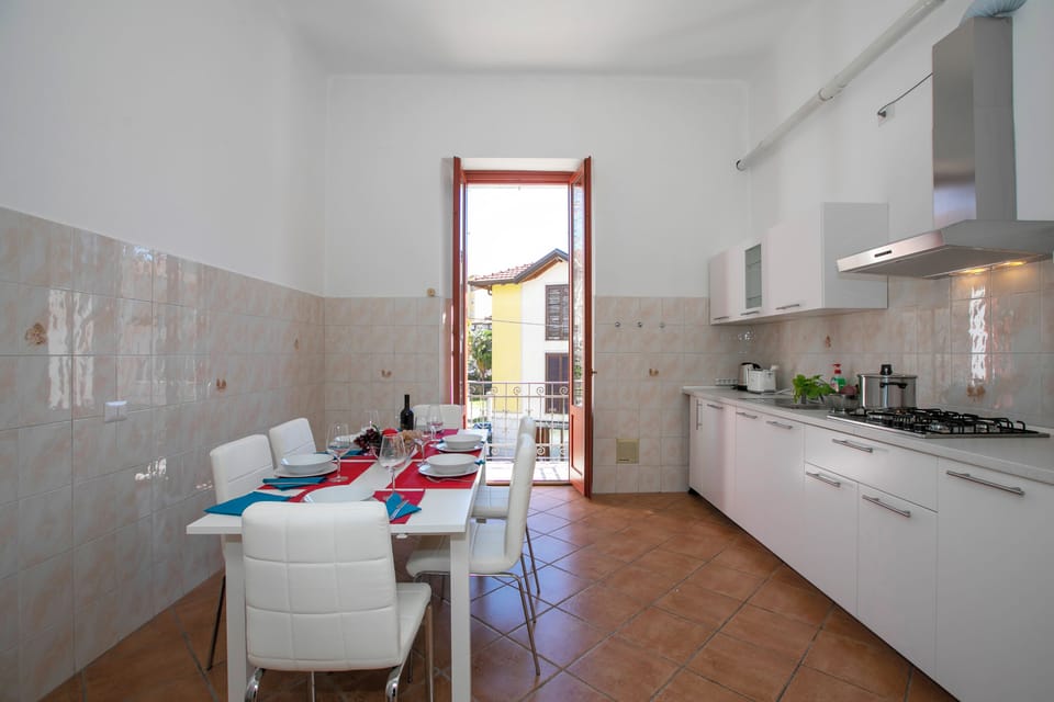 Family Apartment, 2 Bedrooms, Balcony, Lakeside (Residenza Gardenia - Lake View) | Private kitchen | Coffee/tea maker, full-size fridge, microwave, oven