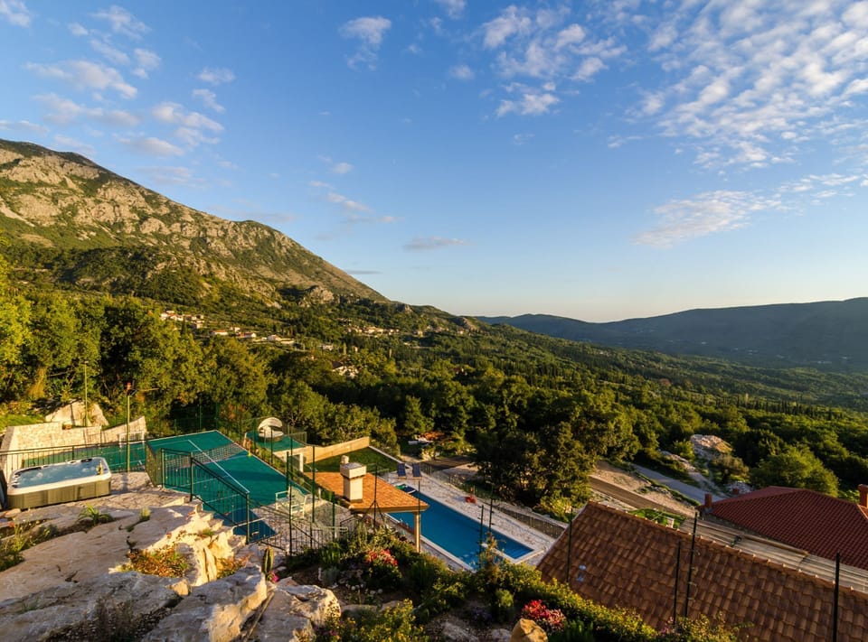 Villa (Four-Bedroom Villa with Terrace) | Pool | Seasonal outdoor pool, pool umbrellas, sun loungers