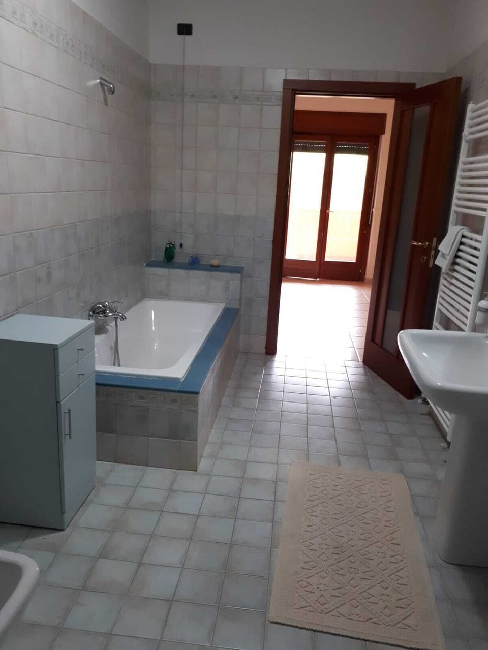Shower, rainfall showerhead, bidet, towels