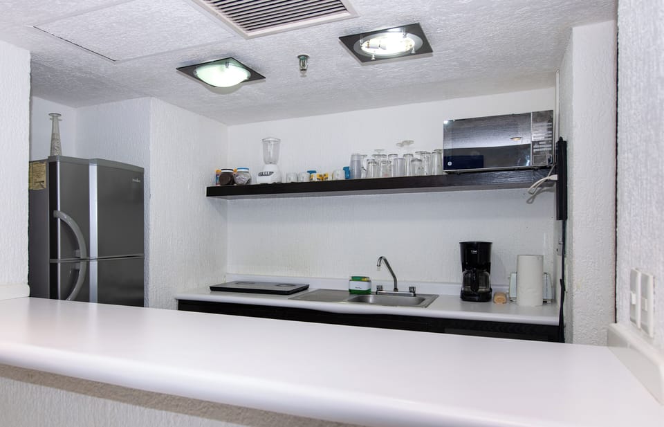 Comfort Suite, 2 Bedrooms, Private Bathroom | Private kitchen | Coffee/tea maker, dining tables