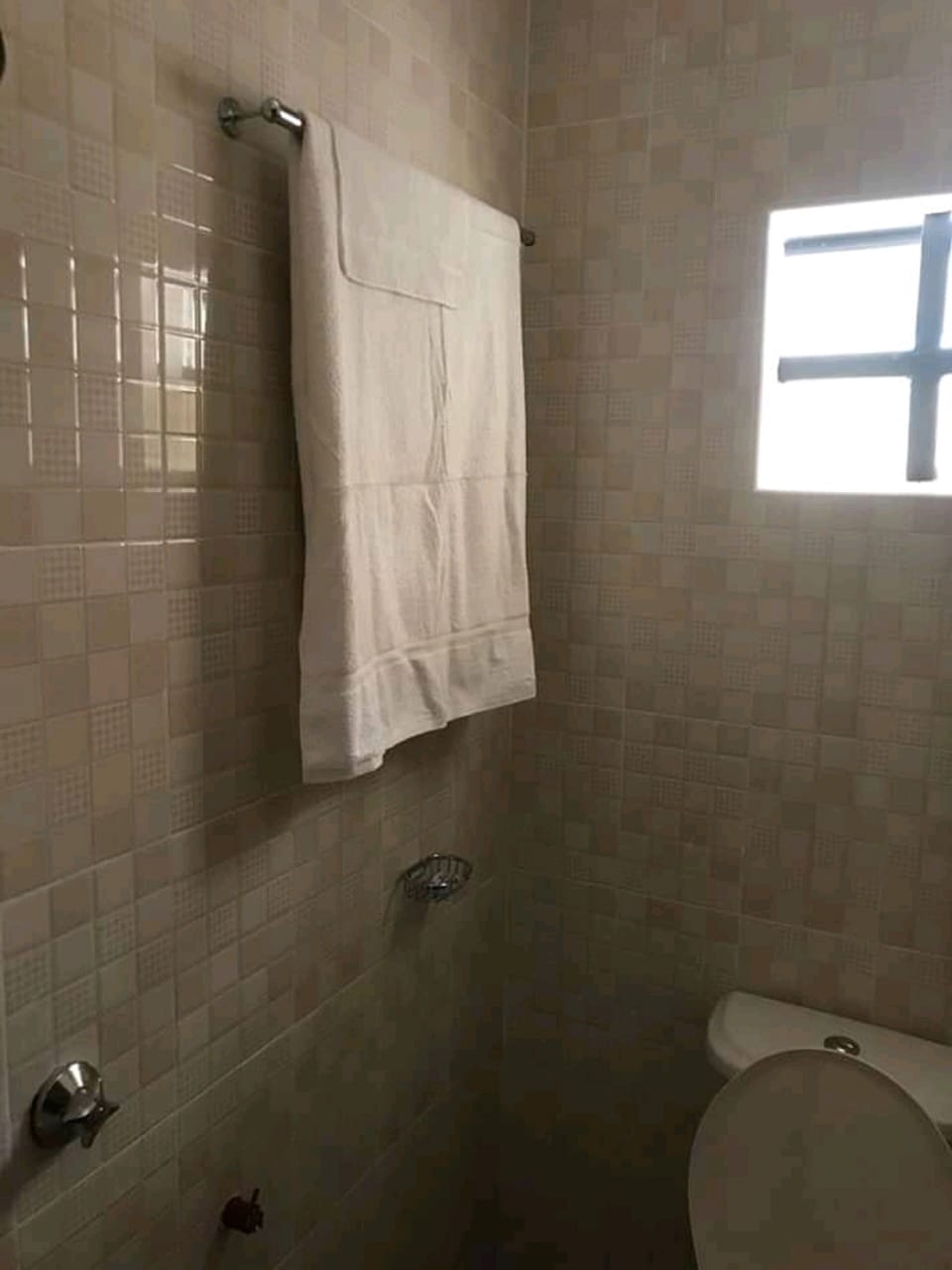 Shower, rainfall showerhead, towels