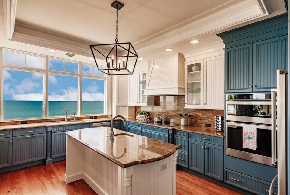 Designer kitchen with high-end finishes and ocean-view windows