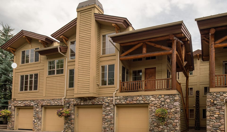 Our garage is below the front door. All of the windows belong to our condo.