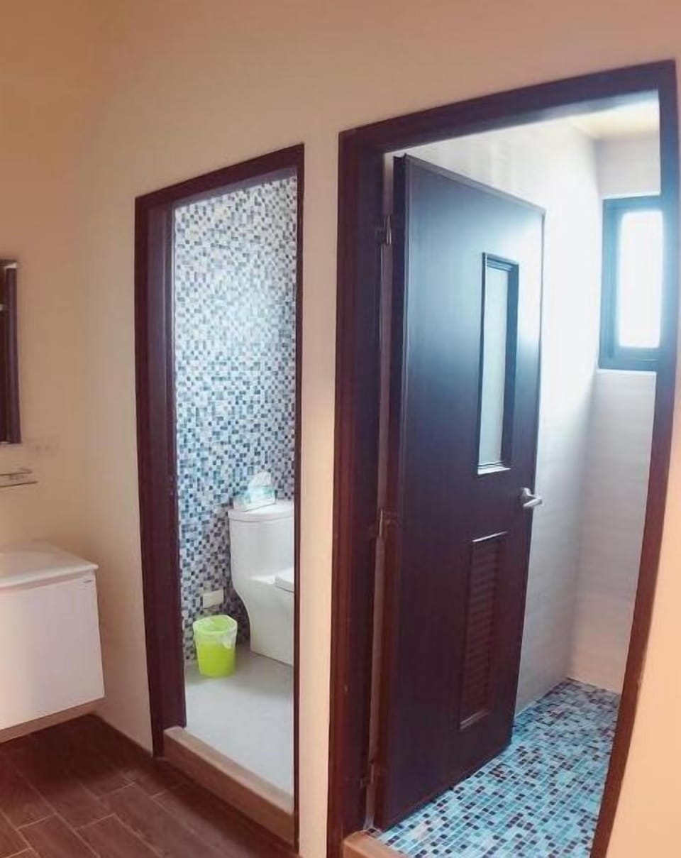 Shower, hair dryer, slippers, towels