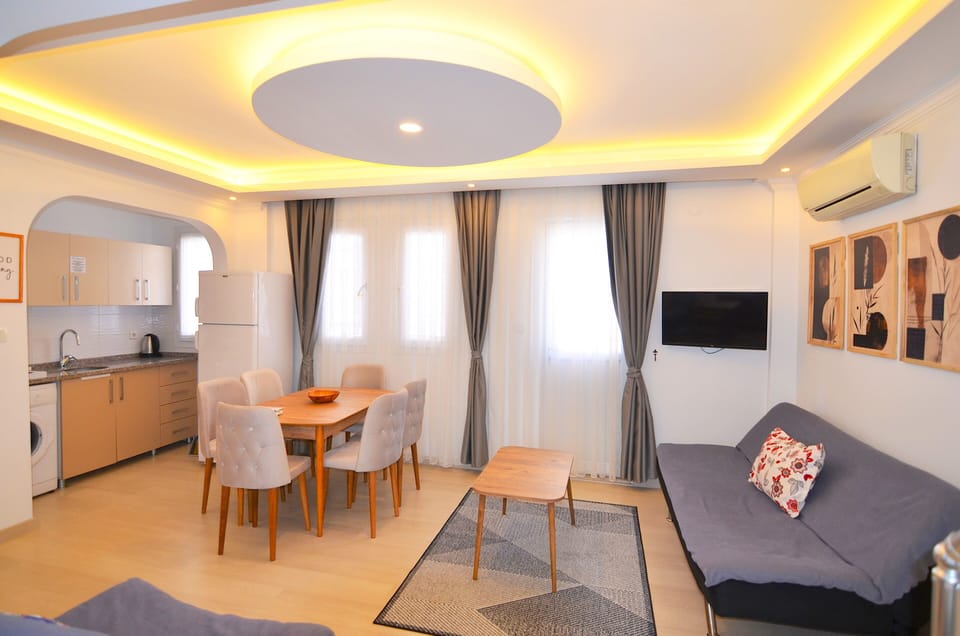 Deluxe Apartment | Living area | 32-inch LCD TV with satellite channels