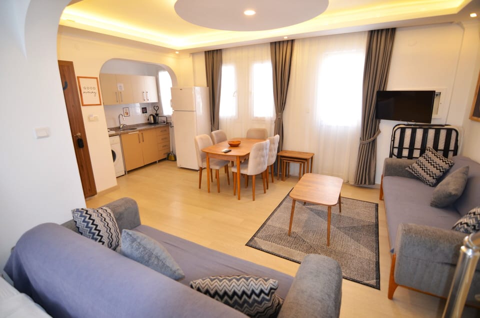 Deluxe Apartment | Living area | 32-inch LCD TV with satellite channels