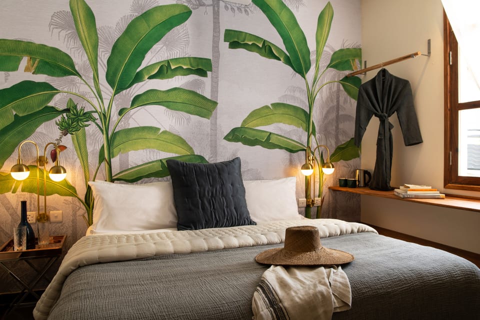 Deluxe Double Room | Minibar, in-room safe, individually decorated, blackout drapes