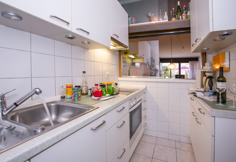 Family Apartment, 1 Bedroom, Microwave, Lakeside (Casa Sibylle with Sauna and Pool) | Private kitchen | Full-size fridge, oven, stovetop, dishwasher