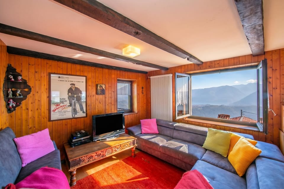 Family Apartment, 3 Bedrooms, 2 Bathrooms (Chalet Cademario) | Living area | 21-inch TV with satellite channels, fireplace, DVD player