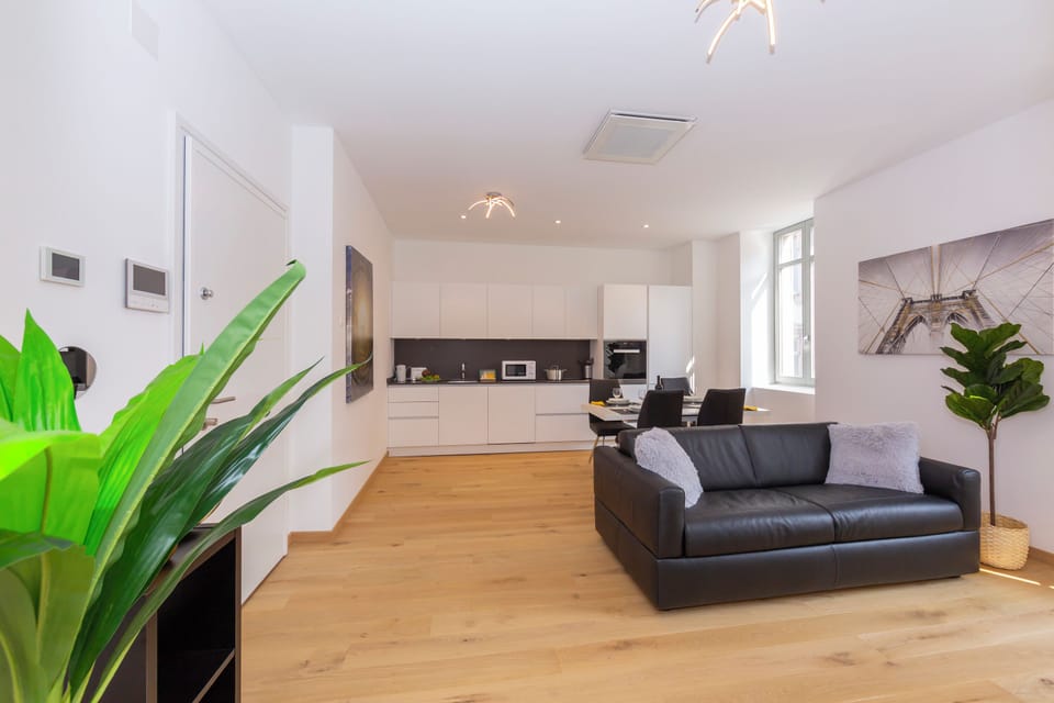Family Apartment, 1 Bedroom, Balcony (Heart of Lugano) | Living area | 22-inch flat-screen TV with satellite channels, TV, heated floors
