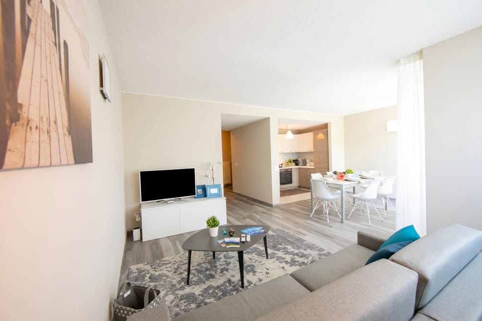 Family Apartment, 3 Bedrooms, 2 Bathrooms (Laguna di Lugano) | Living area | 22-inch flat-screen TV with digital channels, TV, DVD player
