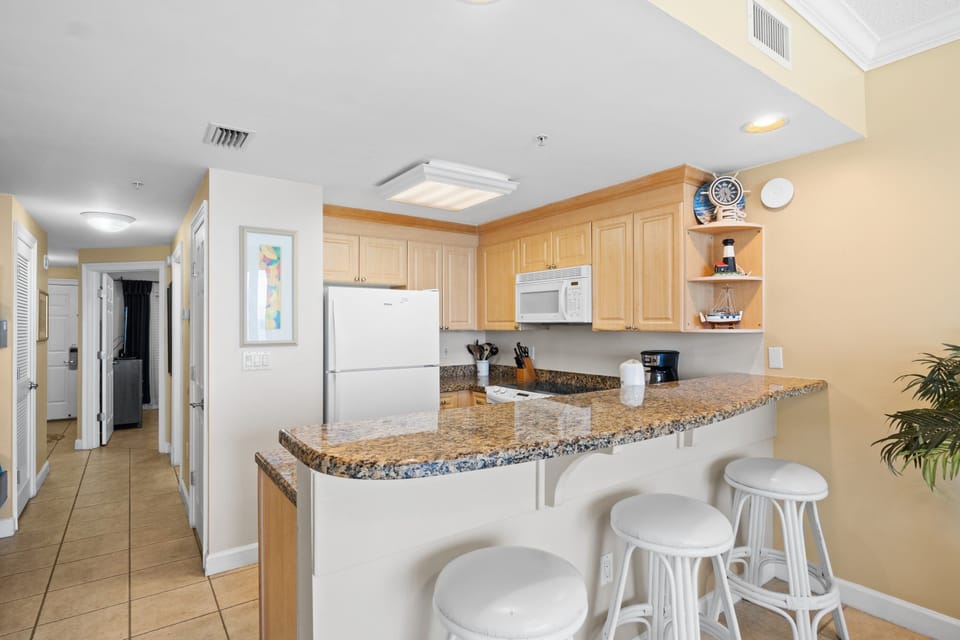 Fully Stocked Kitchen with Bar Seating