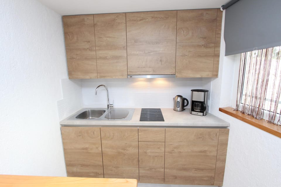 Studio, Sea View | Private kitchen | Fridge, stovetop, dishwasher, coffee/tea maker