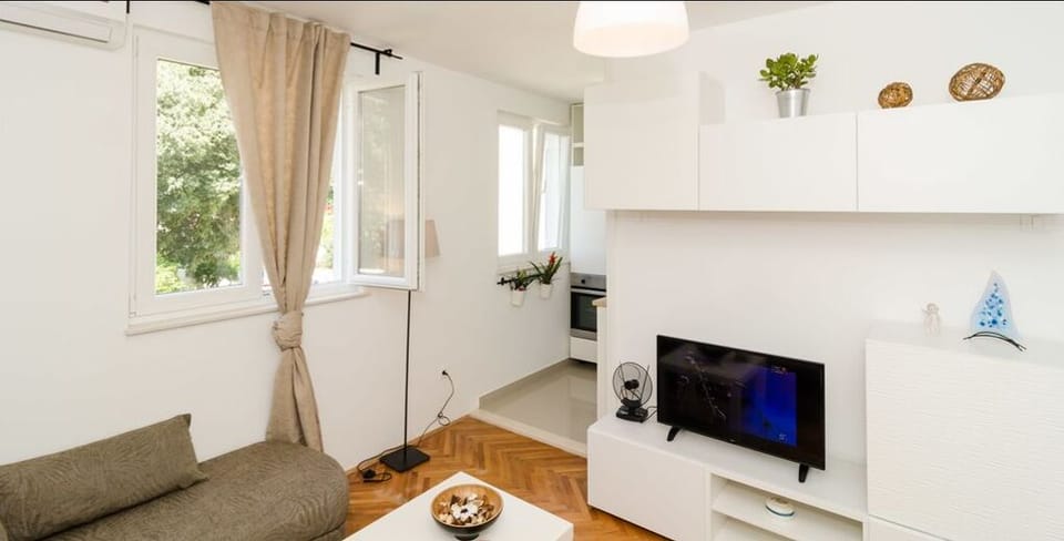 Standard Apartment, 1 Bedroom | Living area | Flat-screen TV