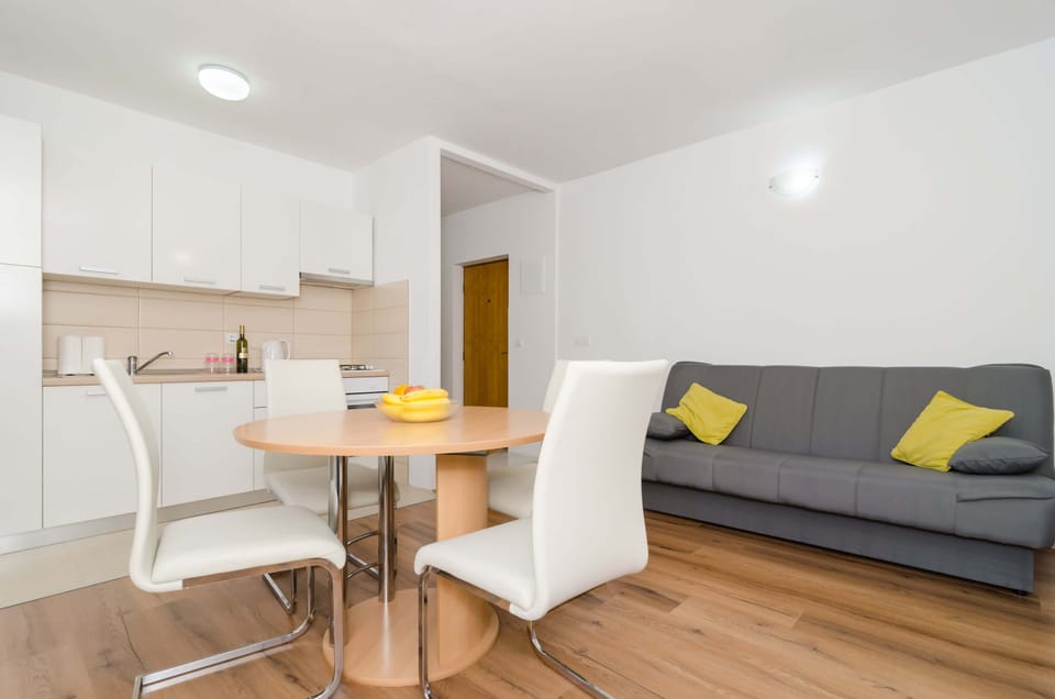 Standard Apartment, 2 Bedrooms, Balcony | Living area | Flat-screen TV