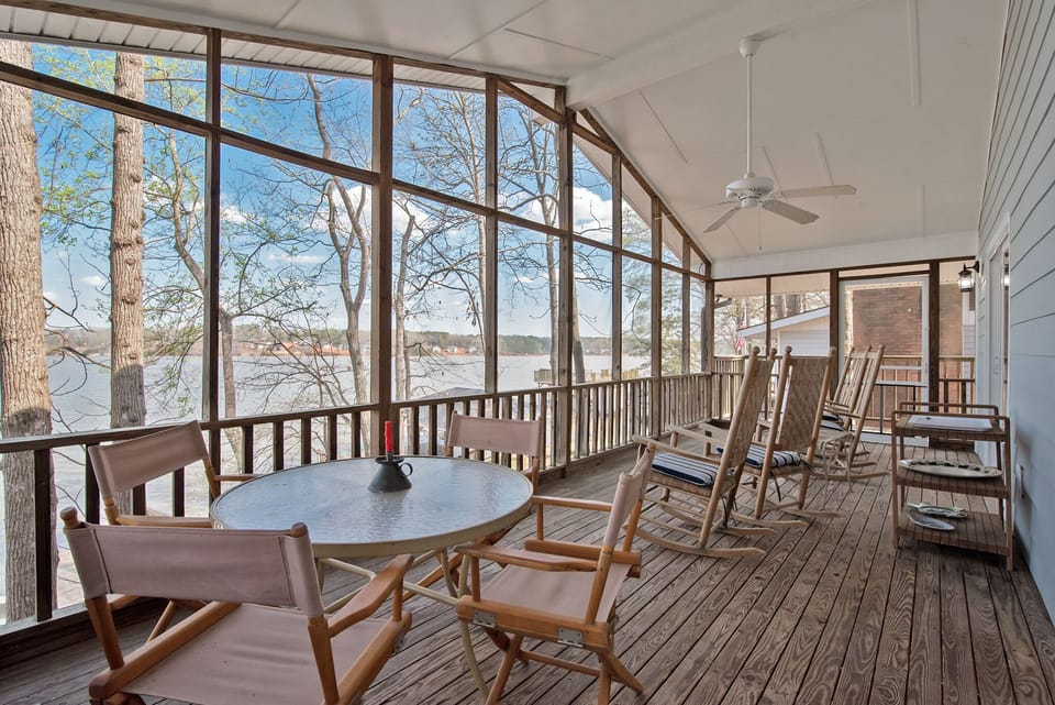 Large screened in porch with terrific views of the lake and outside dining area
