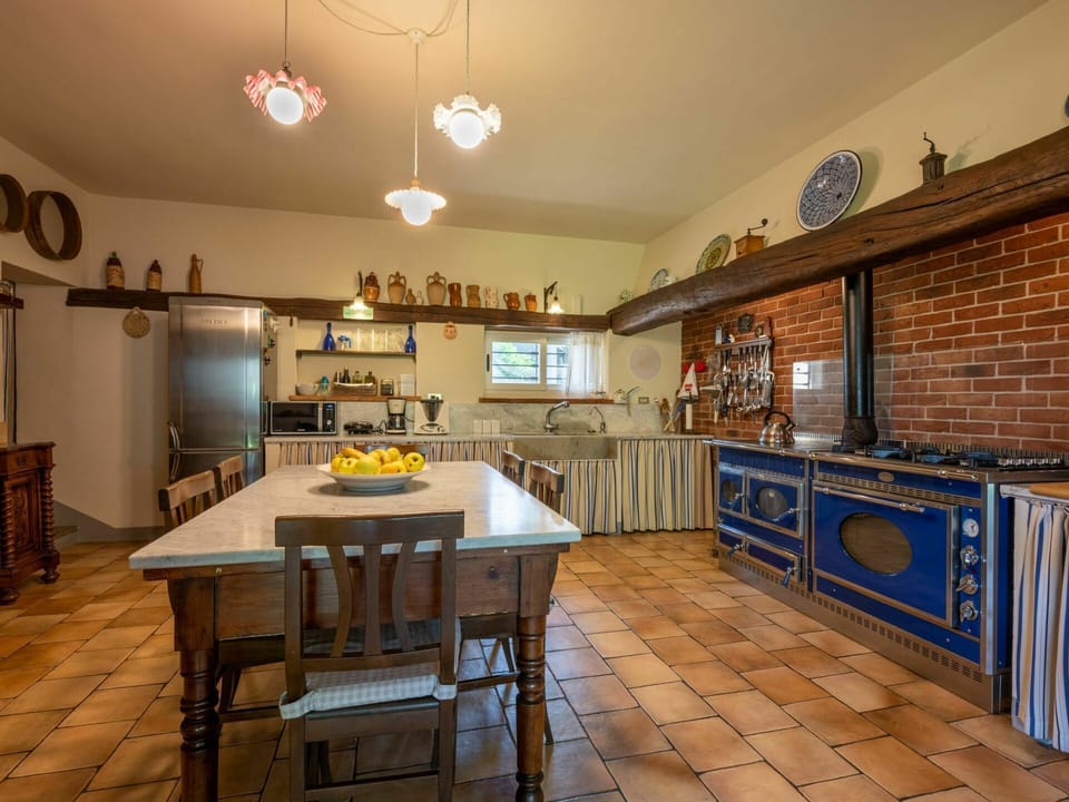 Furniture, Table, Property, Cabinetry, Countertop, Kitchen, Chair, Wood, Lighting, Interior Design