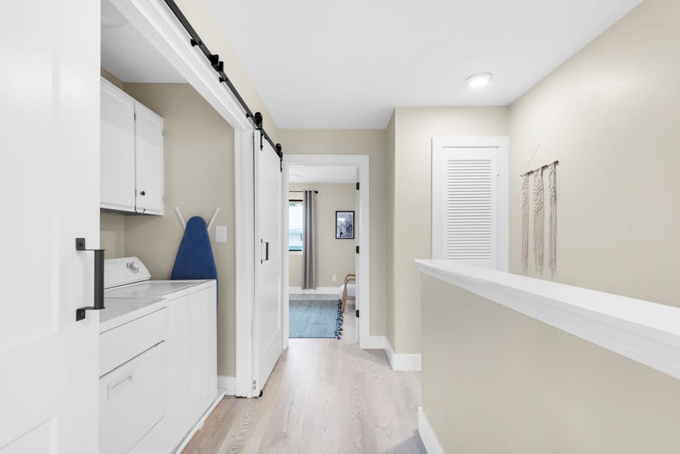 Hallway with washer and dryer