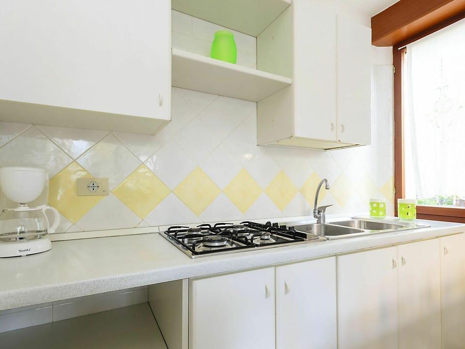 Countertop, Property, Room, Kitchen, Green, Yellow, Furniture, Tile, Interior Design, Cabinetry