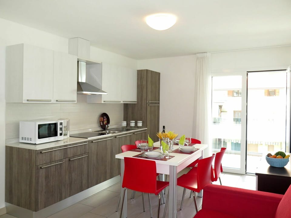 Room, Furniture, Countertop, Kitchen, Property, Interior Design, Cabinetry, Building, Yellow, House