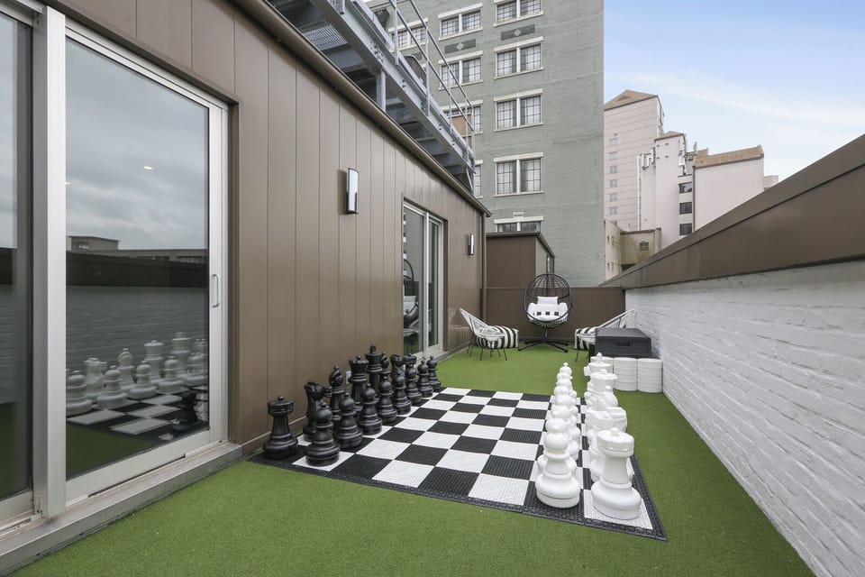 Games, games, games! Enjoy this spacious balcony featuring large-scale checkers/chess, mini putt putt, and ping pong. Perfect for kids and the kids-at-heart! Enjoy hanging out with breathtaking views of the Crescent City!