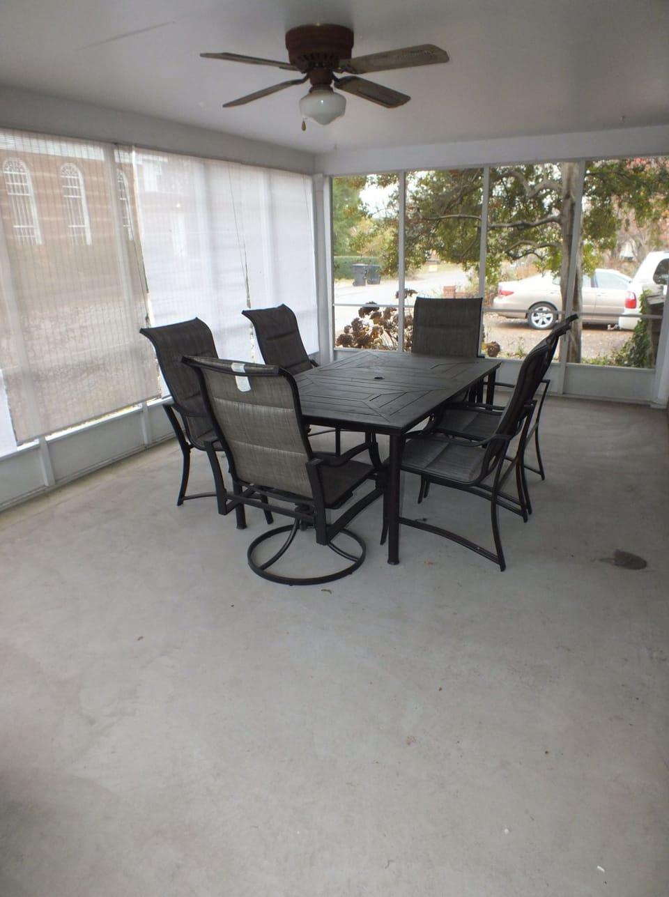 Screened-in, covered patio with dining area and other seating area (no photo)