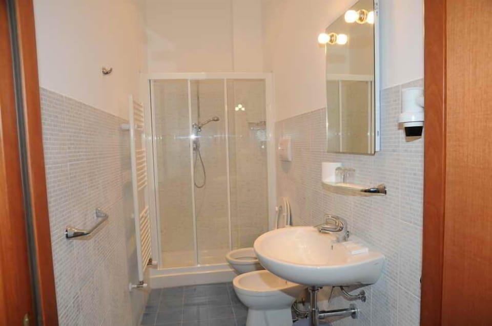 Shower, free toiletries, hair dryer, slippers