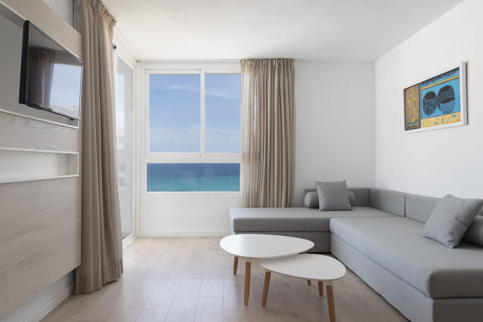 Family Room, Balcony (4 adults) | Living room | Flat-screen TV
