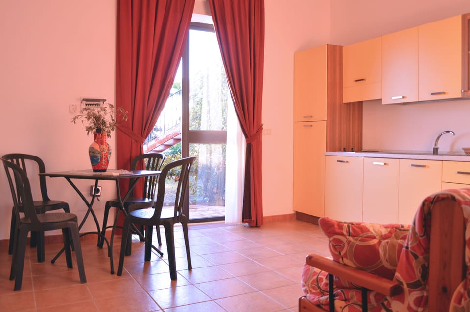 Apartment, 1 Bedroom | Living area | 26-inch flat-screen TV with digital channels, TV