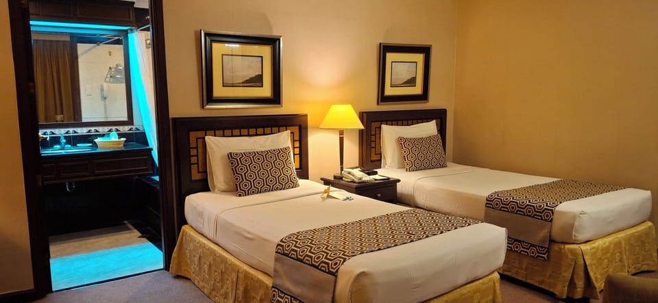 Superior Twin Room | Minibar, in-room safe, individually decorated, individually furnished