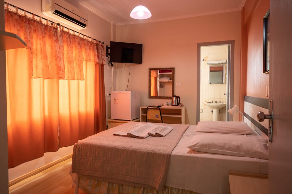Standard Double Room | Minibar, in-room safe, desk, blackout drapes