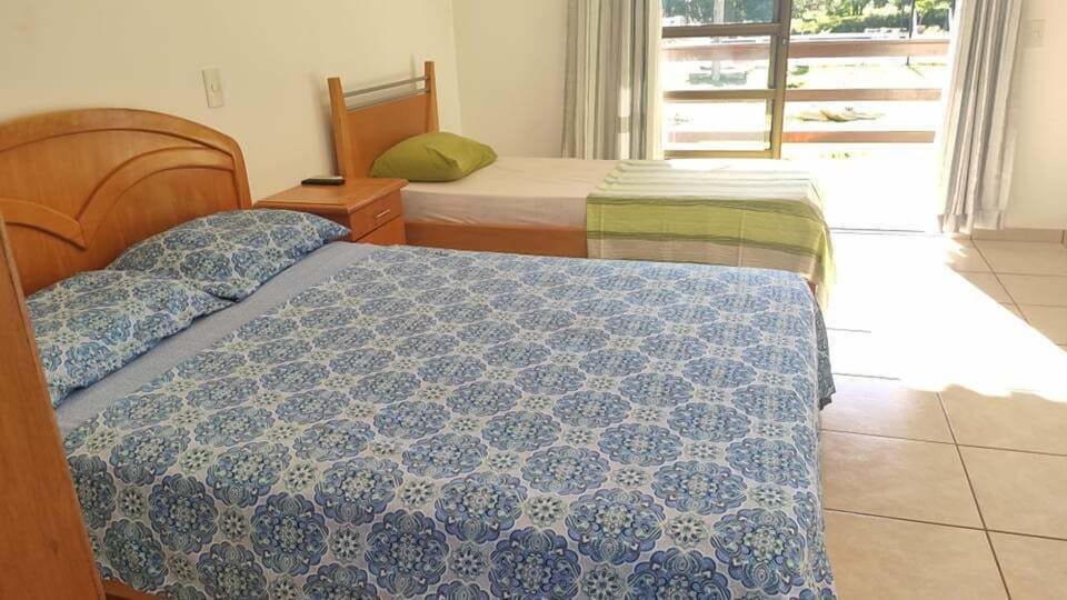 Economy Triple Room | Blackout drapes, bed sheets