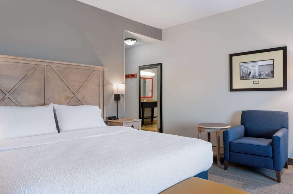 Premium bedding, desk, laptop workspace, blackout drapes