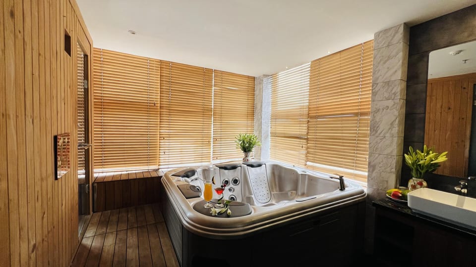 Grand Studio | Bathroom | Deep soaking tub, eco-friendly toiletries, hair dryer, bathrobes