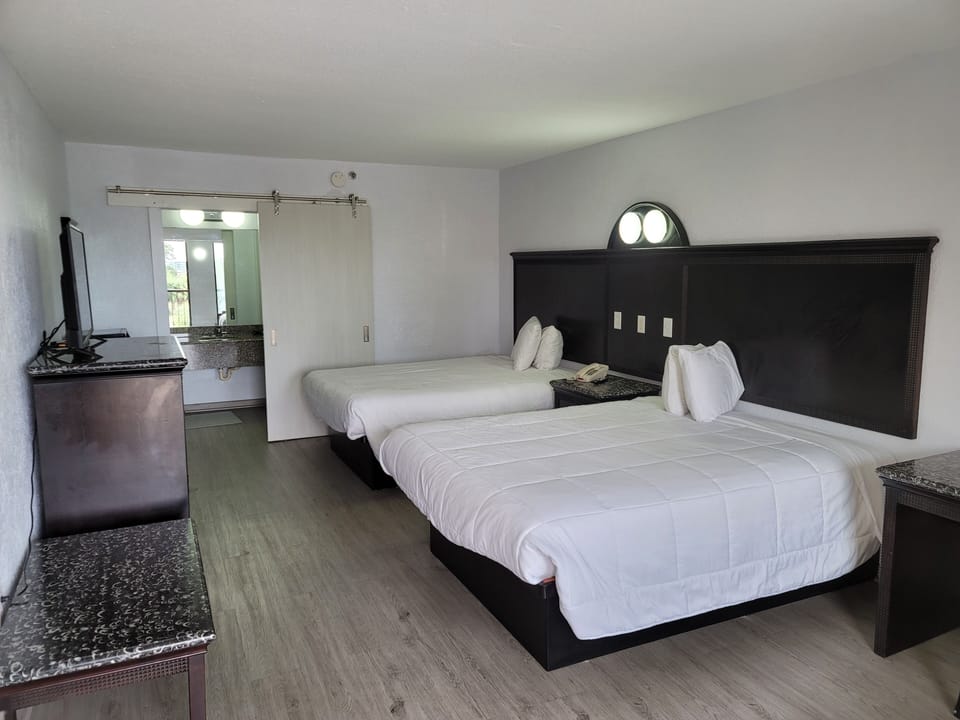 Standard Room, 2 Queen Beds, Non Smoking | Iron/ironing board, free WiFi, bed sheets