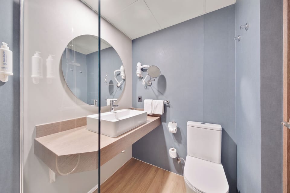 Shower, eco-friendly toiletries, hair dryer, towels