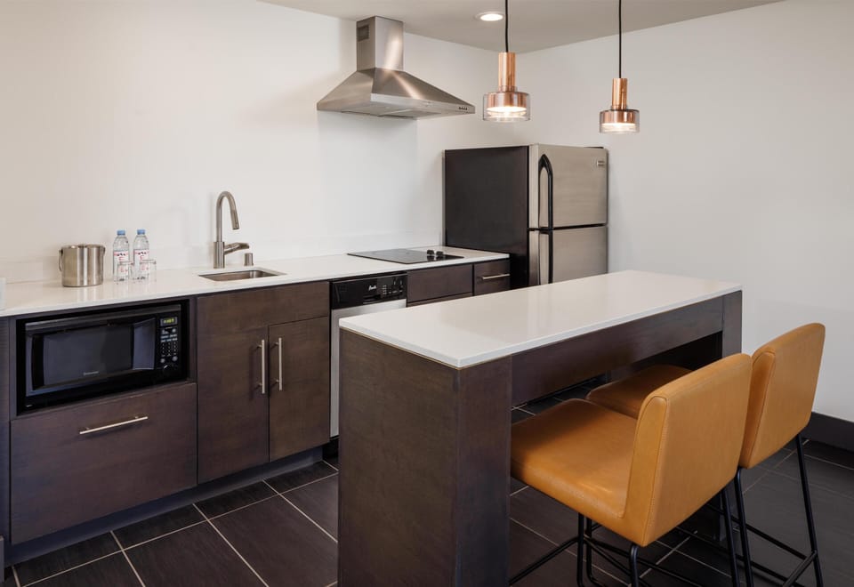 Suite, 1 King Bed, Non Smoking, Kitchen | Private kitchen | Fridge, microwave, coffee/tea maker, eco-friendly cleaning products