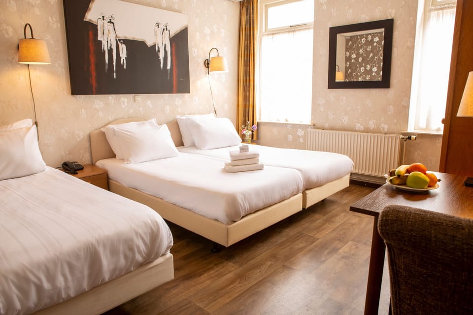 Triple Room | Desk, iron/ironing board (on request), WiFi (free), bed sheets