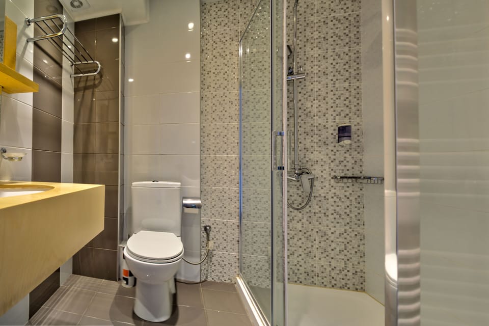 Family Room, Garden View | Bathroom | Shower, hair dryer, towels