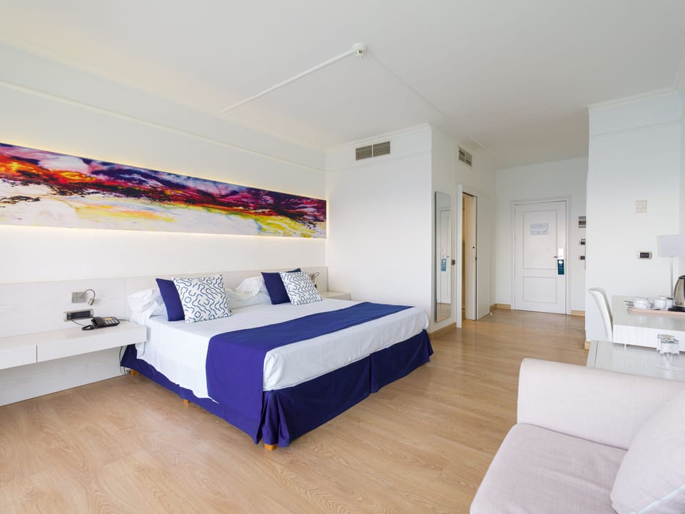 Minibar, desk, blackout drapes, iron/ironing board