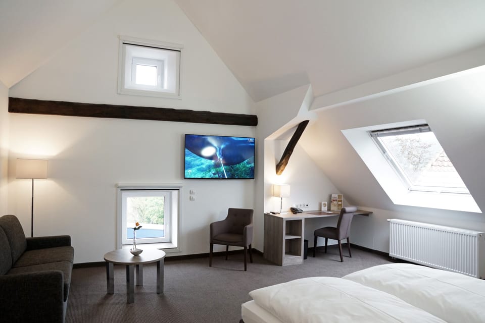 Deluxe Studio | Living area | 30-inch flat-screen TV with cable channels, tablet