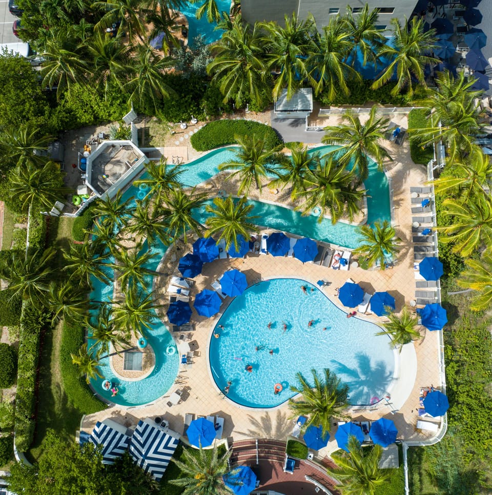 Outdoor pool, pool umbrellas, sun loungers